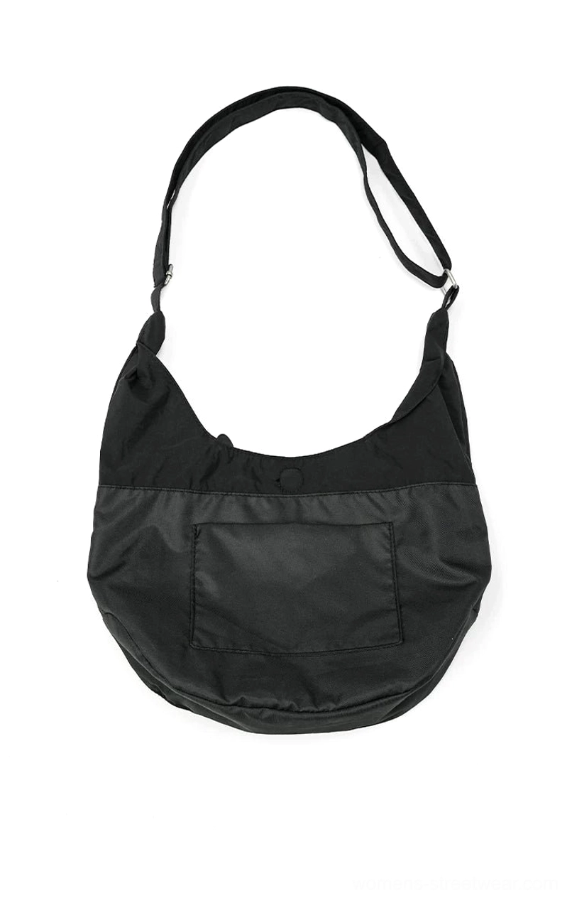 Matte black utility sling hobo crossbody bag front view with crescent shape front pocket adjustable metal buckle strap and snap closure