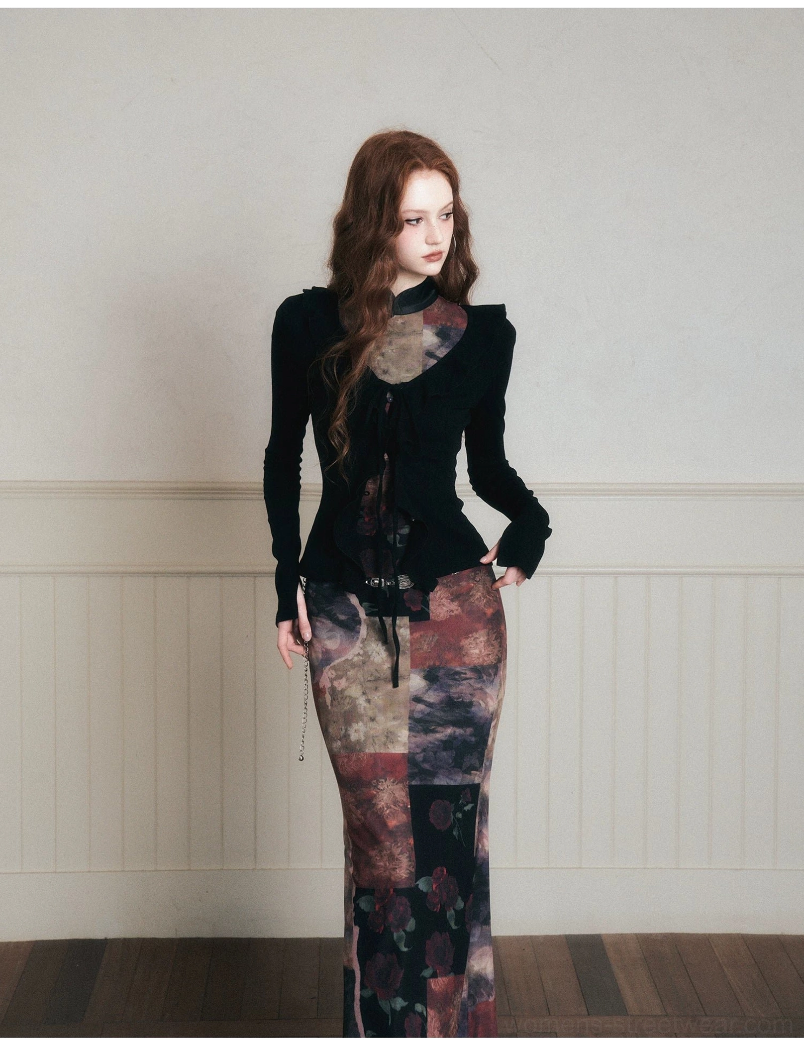 Styling reference of a black velvet top paired with a high-waisted dark floral patchwork maxi skirt