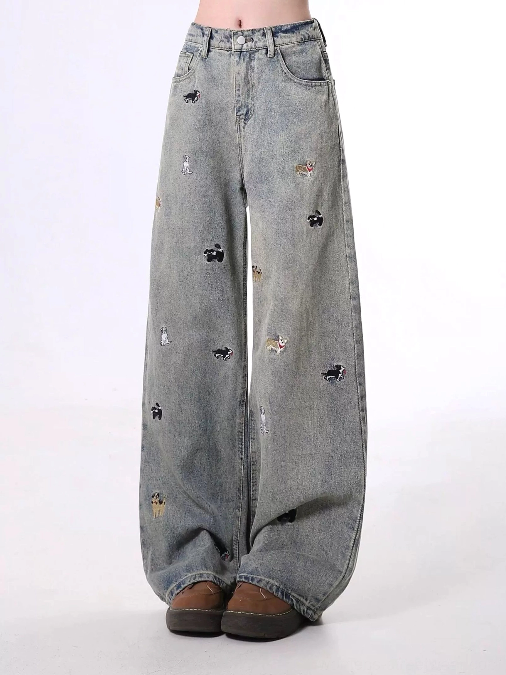 Nostalgic blue vintage washed wide leg denim jeans with scattered dog embroidery front full length view