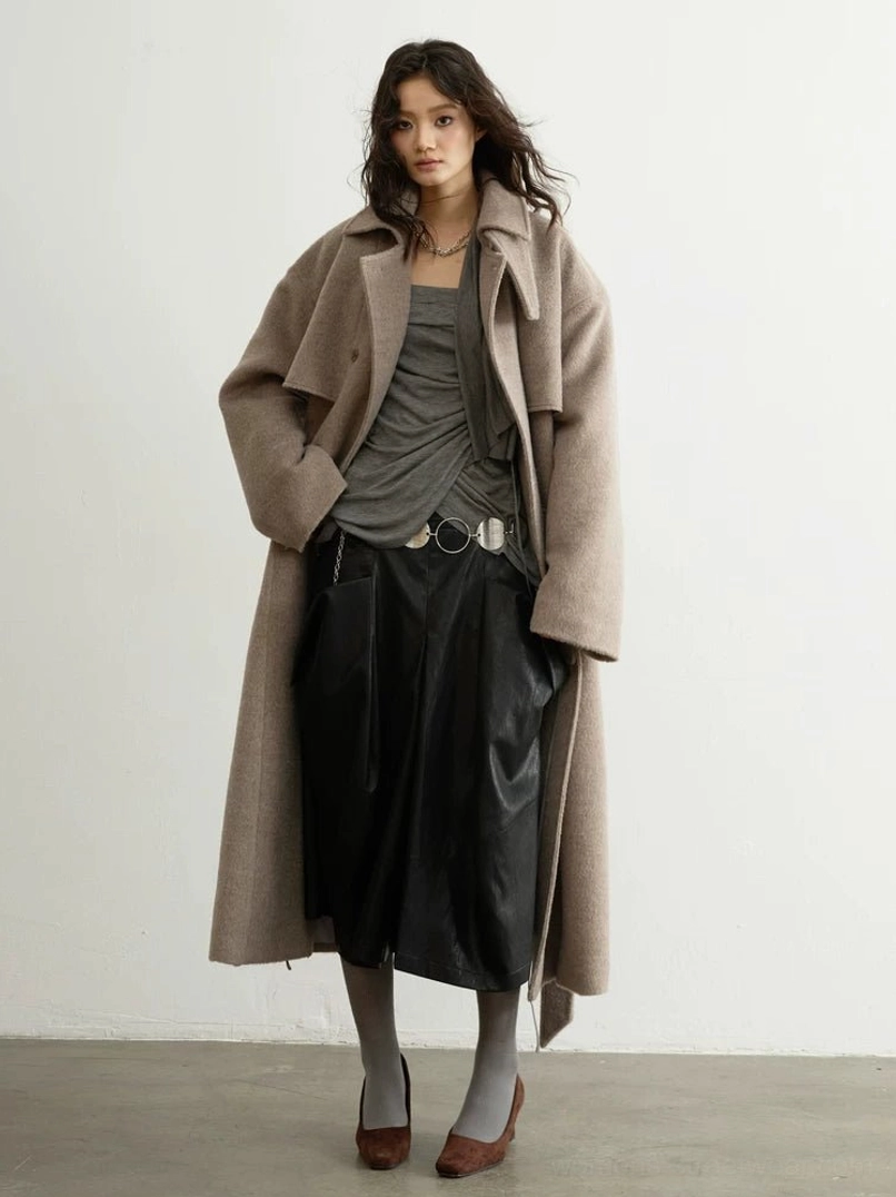 Oatmeal double-breasted oversized wool blend trench coat flat lay showing matching belt and front pockets