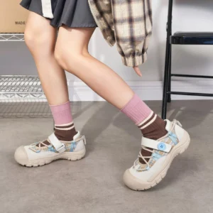 Oatmeal and light blue plaid sport Mary Jane shoes styled with a JK-inspired outfit and striped crew socks, showing the adjustable strap and thick non-slip rubber outsole