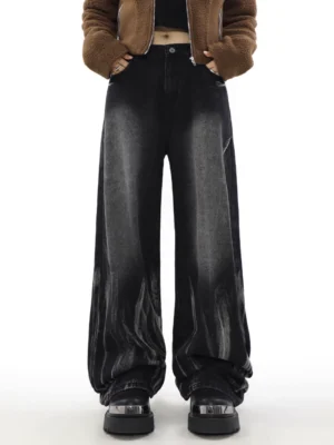 Front full-body view of washed black obsidian fade high-waisted wide-leg streetwear jeans styled with a cropped fleece jacket and platform shoes
