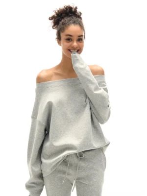 Heather gray oversized off-shoulder sweatshirt with matching drawstring flare sweatpants front view