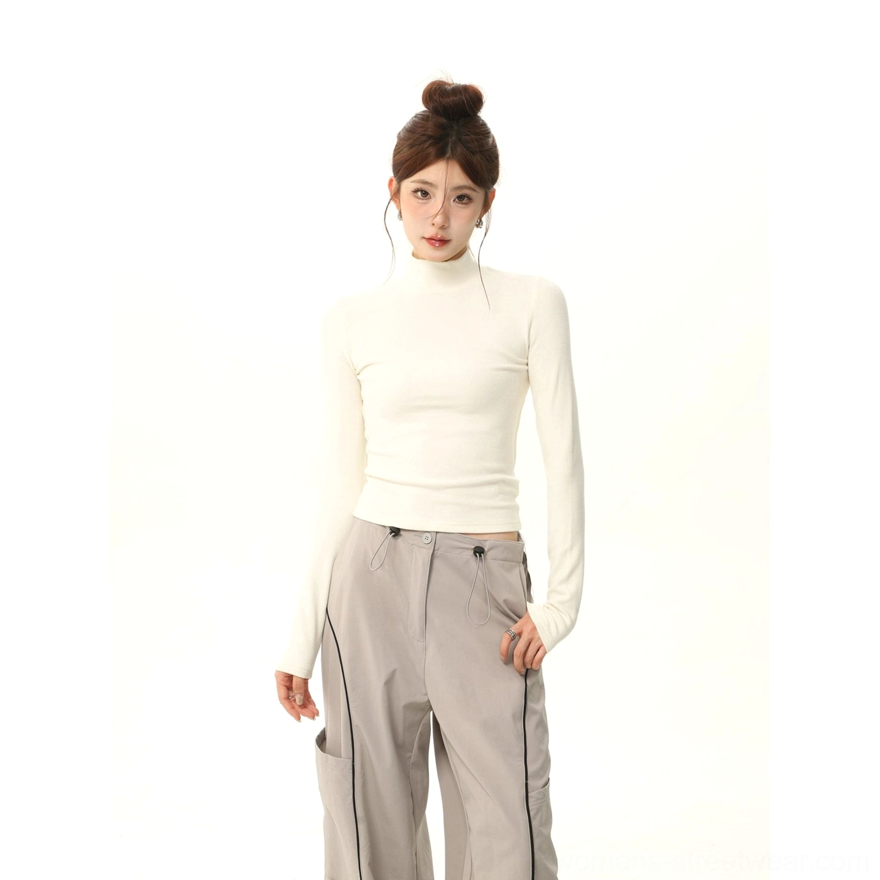 Off-white brushed mock neck slim fit long sleeve T-shirt styled with grey wide-leg cargo trousers in a minimalist studio