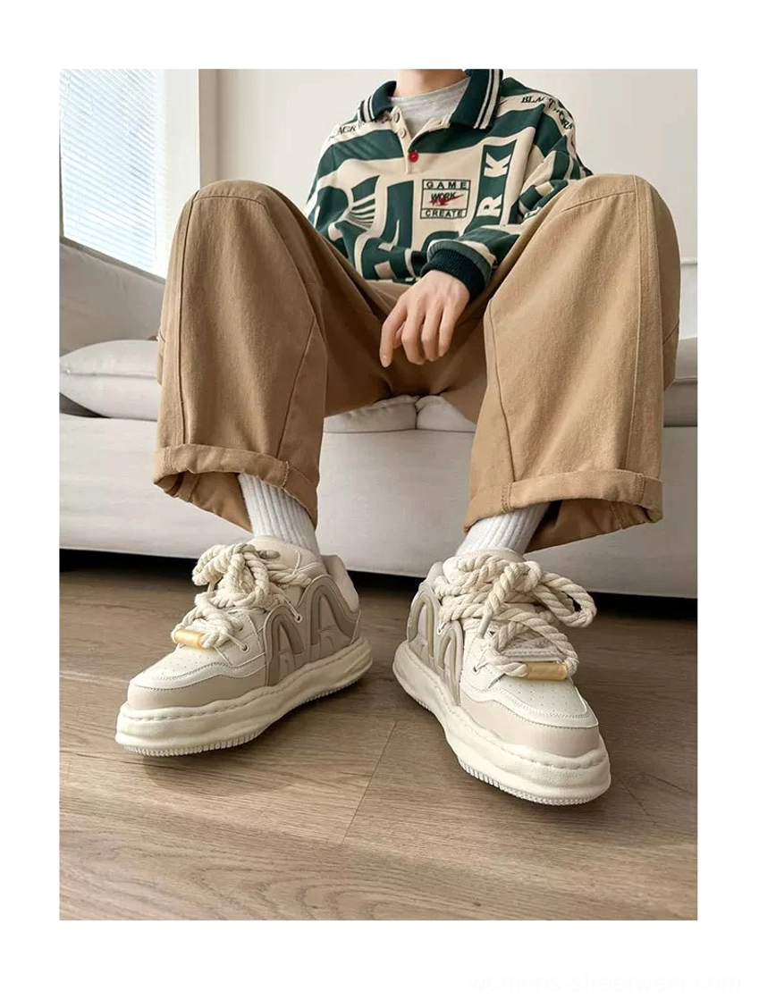 Off-white chunky platform sneakers styled with khaki pants and white socks, showing a minimalist Korean streetwear outfit and elevated thick sole