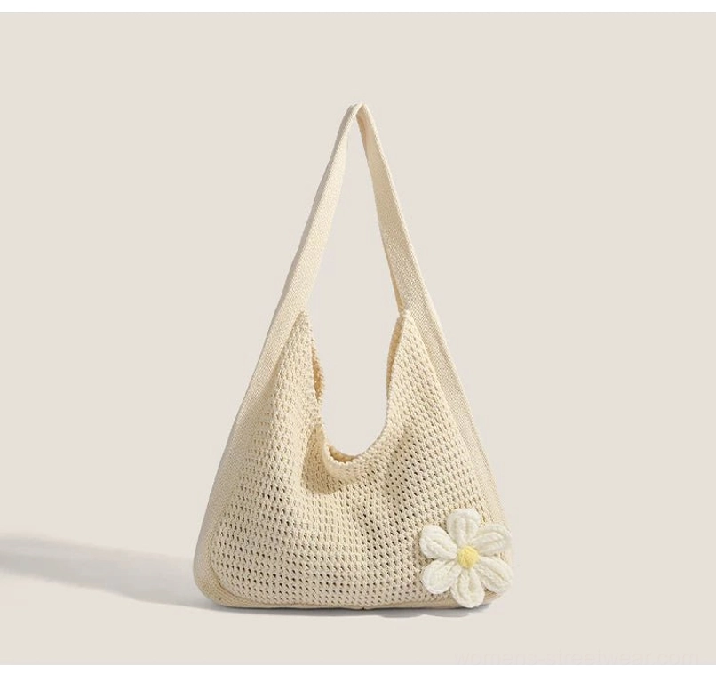Off white crochet hobo shoulder bag with 3d daisy ornament, wide strap, and u-shaped open top