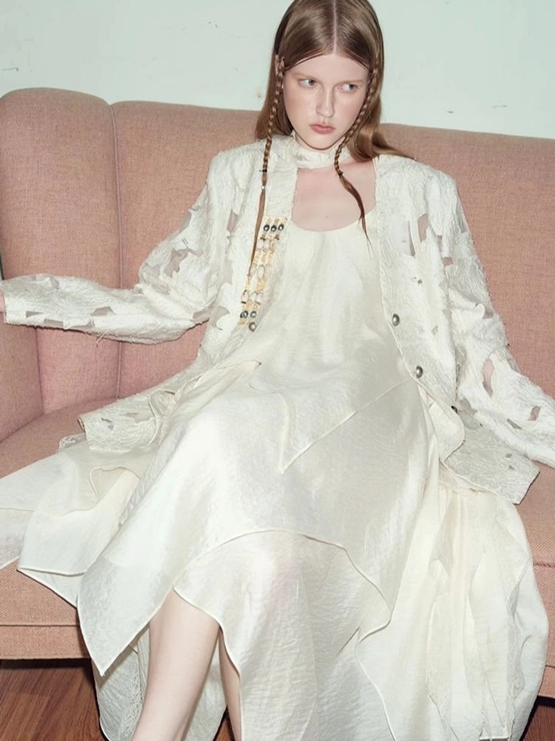 Women’s distressed off-white cutout blazer with avant-garde streetwear styling detail