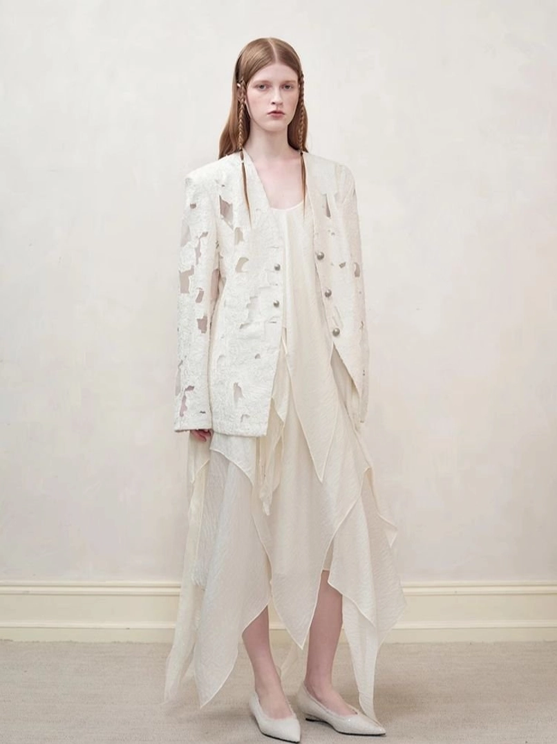 Off-white distressed streetwear blazer for women with draped asymmetric slip dress front full-body outfit view