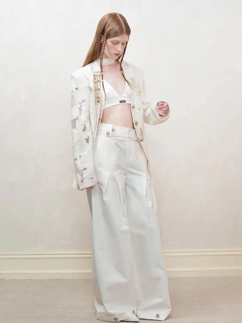 Off-white distressed cutout blazer for women styled as a Korean streetwear layering statement