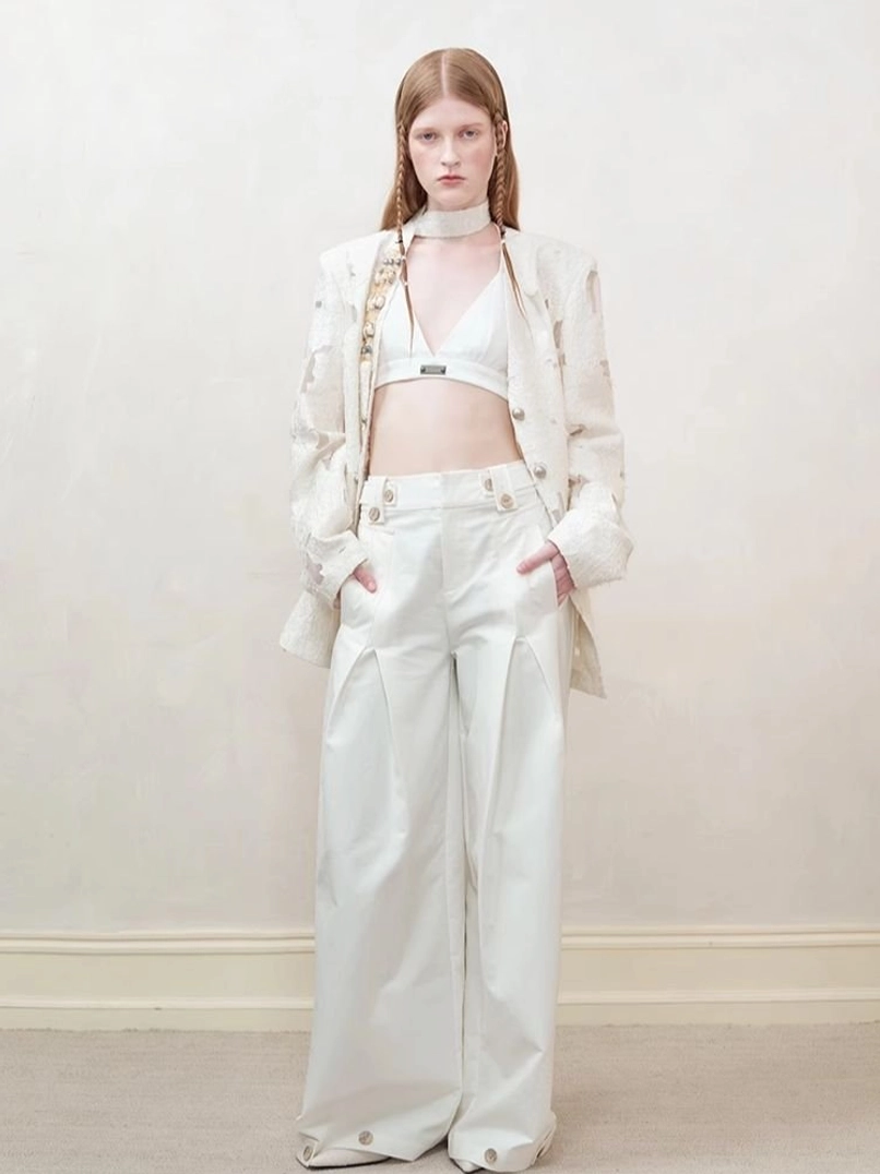 Women’s off-white distressed cutout blazer metal button closure and tailored silhouette detail