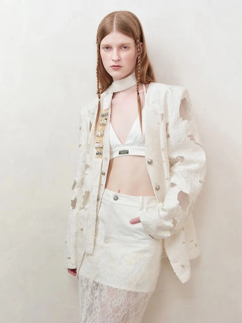 Women’s off-white distressed cutout streetwear blazer design and texture detail