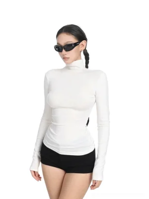 Three-quarter view of an off-white womens fitted turtleneck streetwear top with body-hugging cut, smooth stretch knit fabric, and extended sleeves