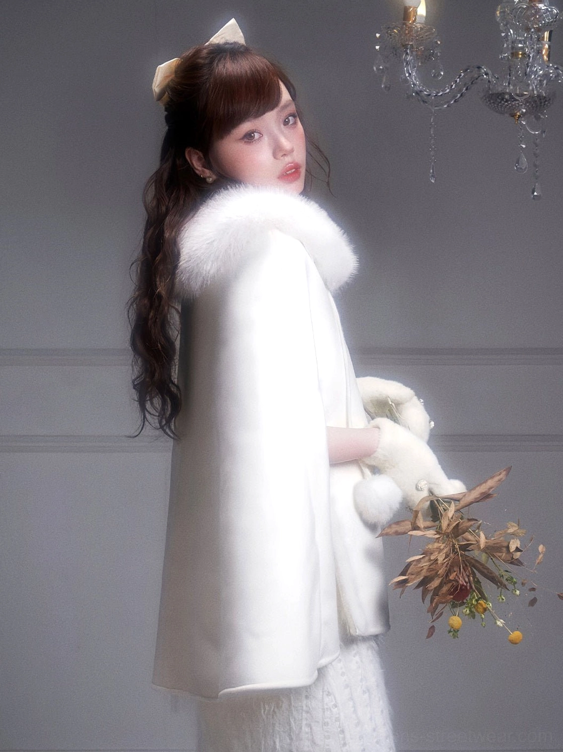 Off-white fur collar cape coat back three-quarter view showing clean draped cape silhouette and winter styling