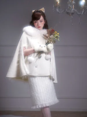 Off-white wool blend cape coat with plush fur collar shown in three-quarter side view with tweed skirt styling