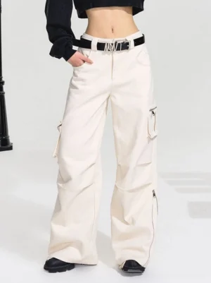 Front full-body view of off-white high-waist utility wide-leg cargo pants styled with a black cropped top