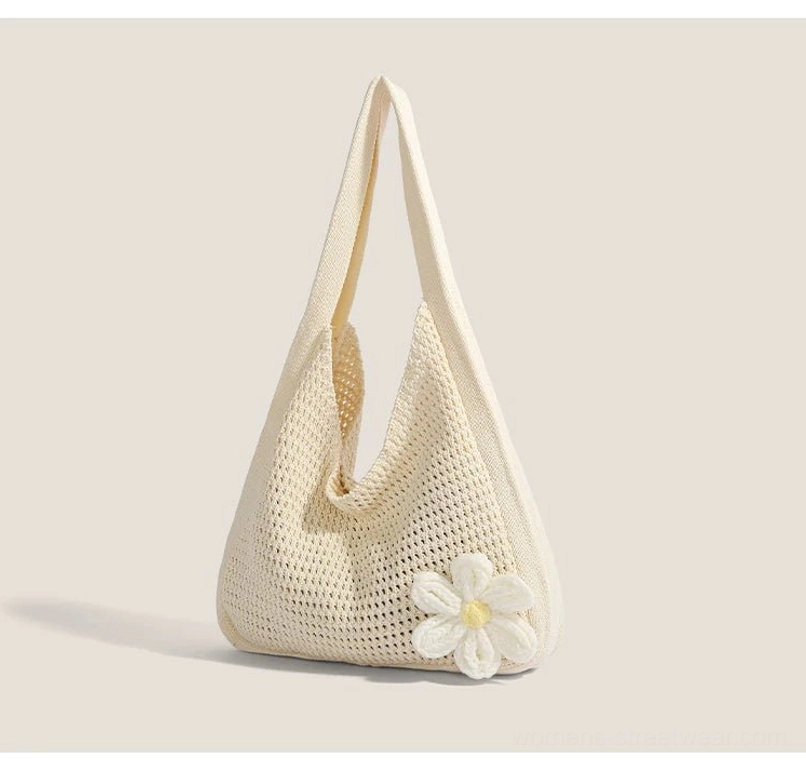 Off white open-knit crochet hobo shoulder bag with daisy flower accent and curved everyday silhouette