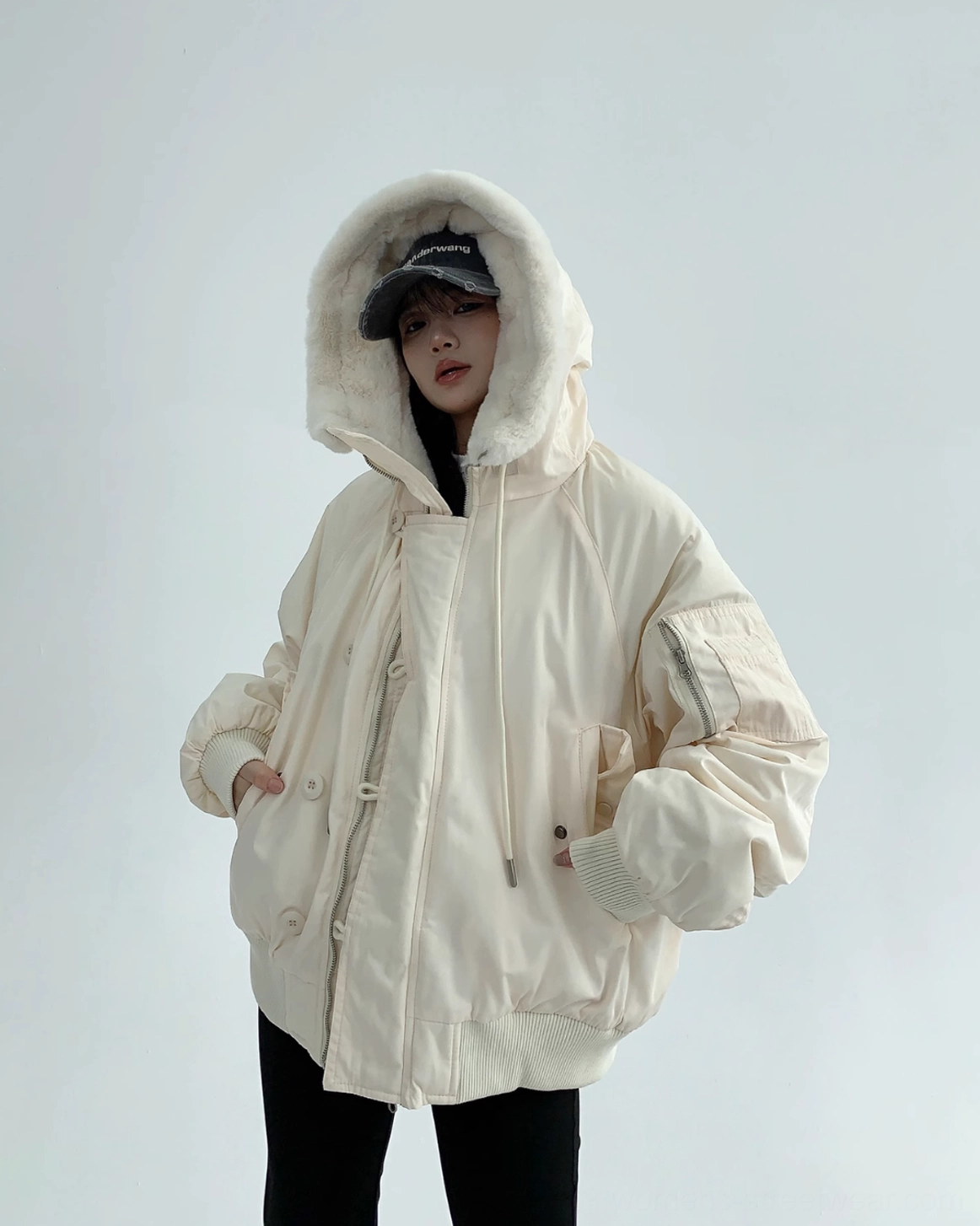 Off-white oversized aviator jacket with warm sherpa texture, adjustable hood, and relaxed Korean fashion styling