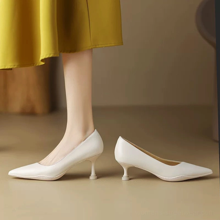 Off-White pointed-toe kitten heel pump pair with sleek leather upper and mustard skirt styling
