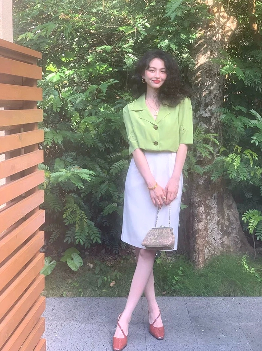 Off-white retro knee-length pencil skirt shown in side view with a lime green shirt for modern Acubi streetwear