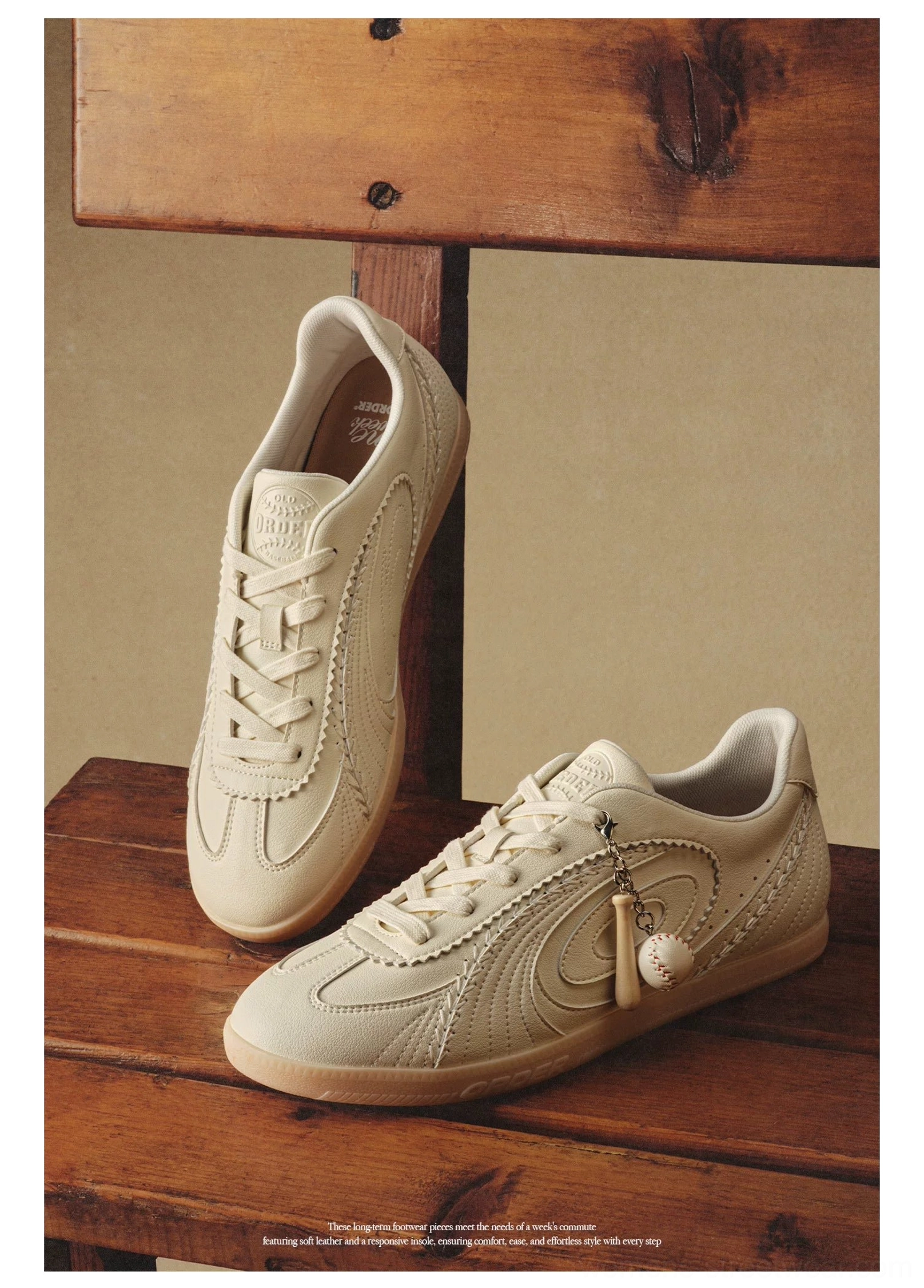 Pair of off-white retro training sneakers displayed on wooden bench showing tonal layered upper