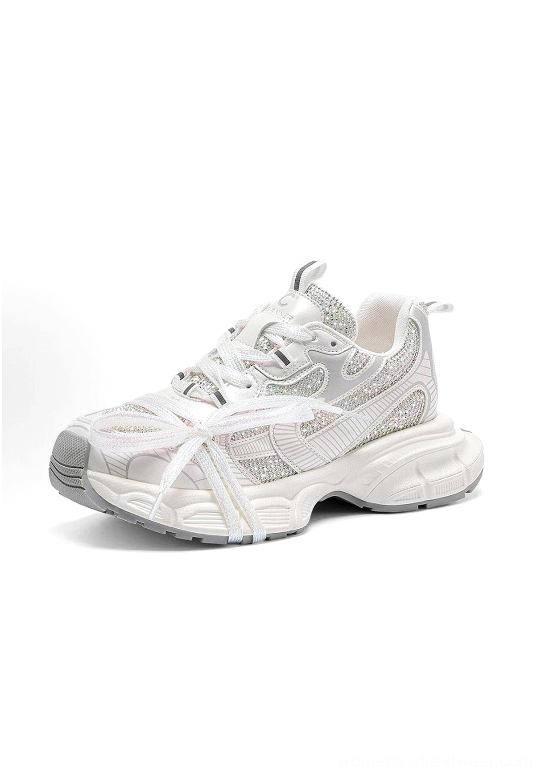 Front three-quarter view of off-white rhinestone chunky dad sneakers with glittering upper and thick white rubber sole