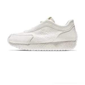 Off-white sculpted spike-sole leather sneakers with embossed upper detailing and thick textured rubber platform outsole in side profile