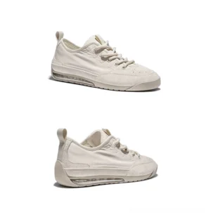 Off-white suede panel low-top air cushion sneakers shown in three-quarter side view with rounded toe and visible cushioned sole