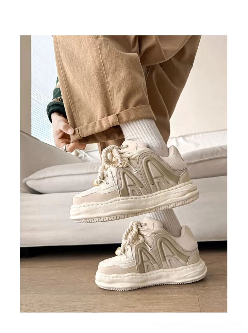 Off-white thick platform sneakers paired with khaki casual pants and white socks, showing the chunky silhouette and elevated streetwear proportions