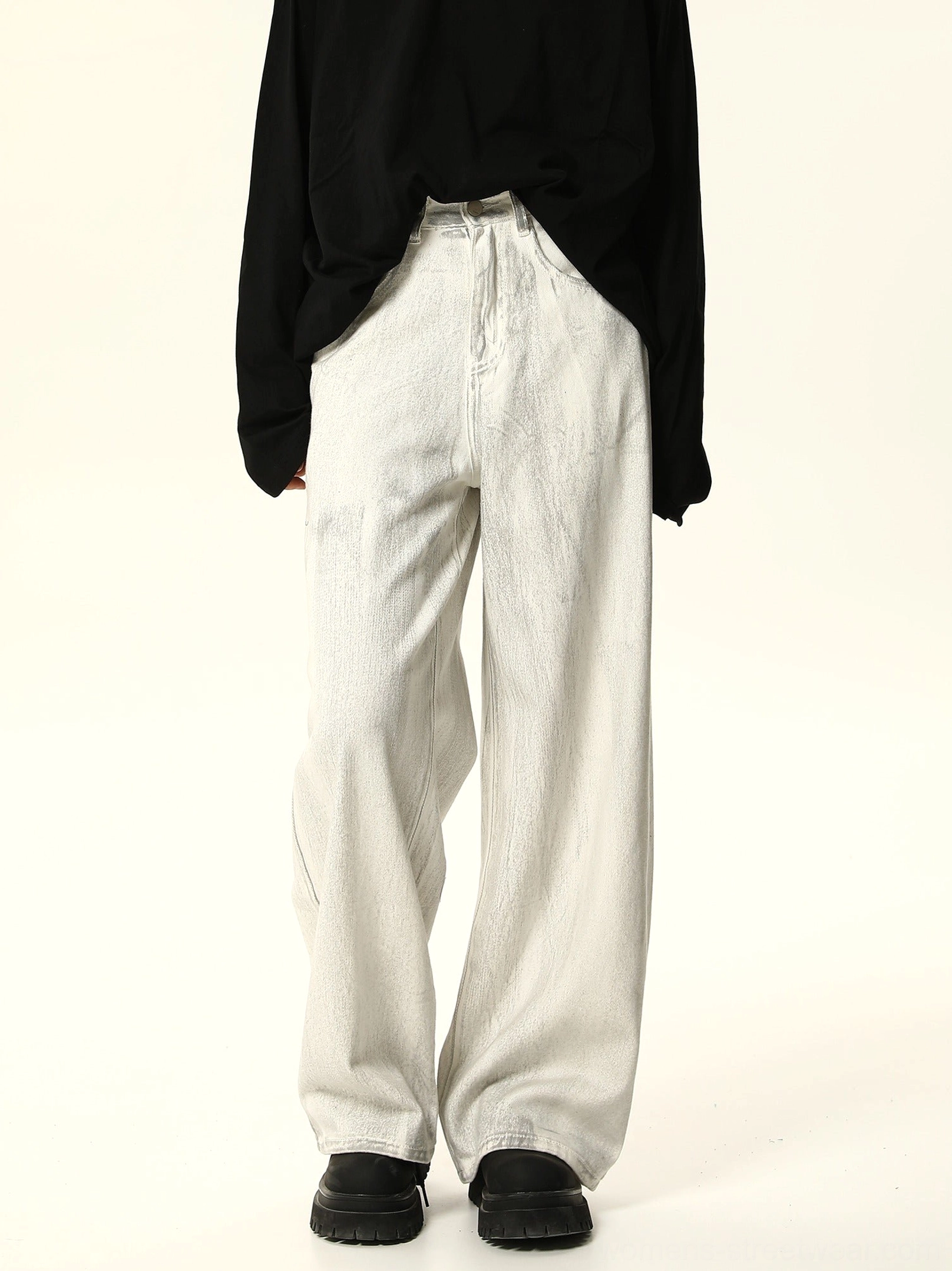 Straight front view of minimalist off-white wide leg denim pants with tonal gray wash, button fly, and oversized streetwear fit