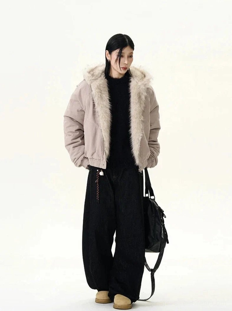 Old Rose faux fur trim hooded bomber jacket side three-quarter view styled with black wide-leg trousers and shoulder bag