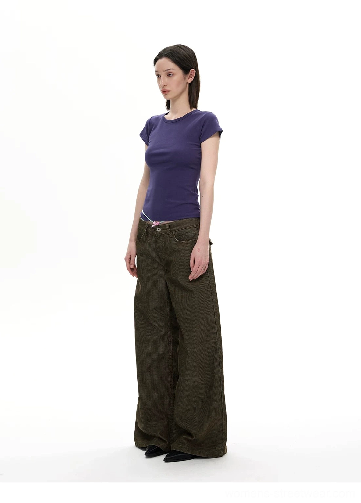 Olive corduroy wide leg streetwear pants front view styled with purple short sleeve top and low waist fit