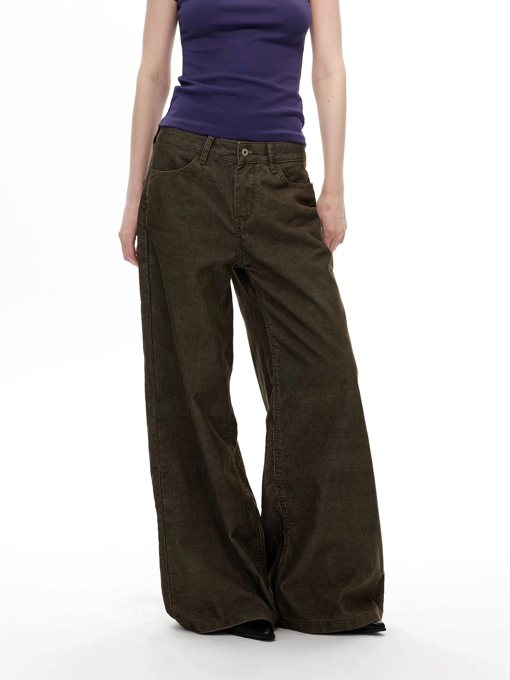 Olive corduroy wide leg streetwear pants front lower body view showing fine ribbed texture and relaxed full length silhouette