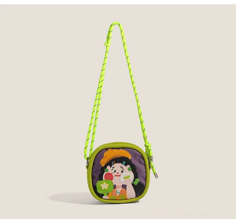 Olive green cartoon mini crossbody bag with fluorescent green rope strap and orange hat character print