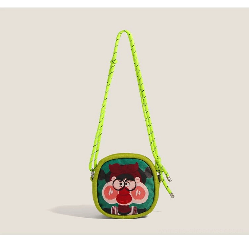Olive green cartoon mini crossbody bag with fluorescent rope strap and red glasses character artwork