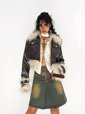 Olive green distressed denim mini skirt styled with a brown leather belt, lace corset top, and fur-trimmed leather jacket in a streetwear outfit