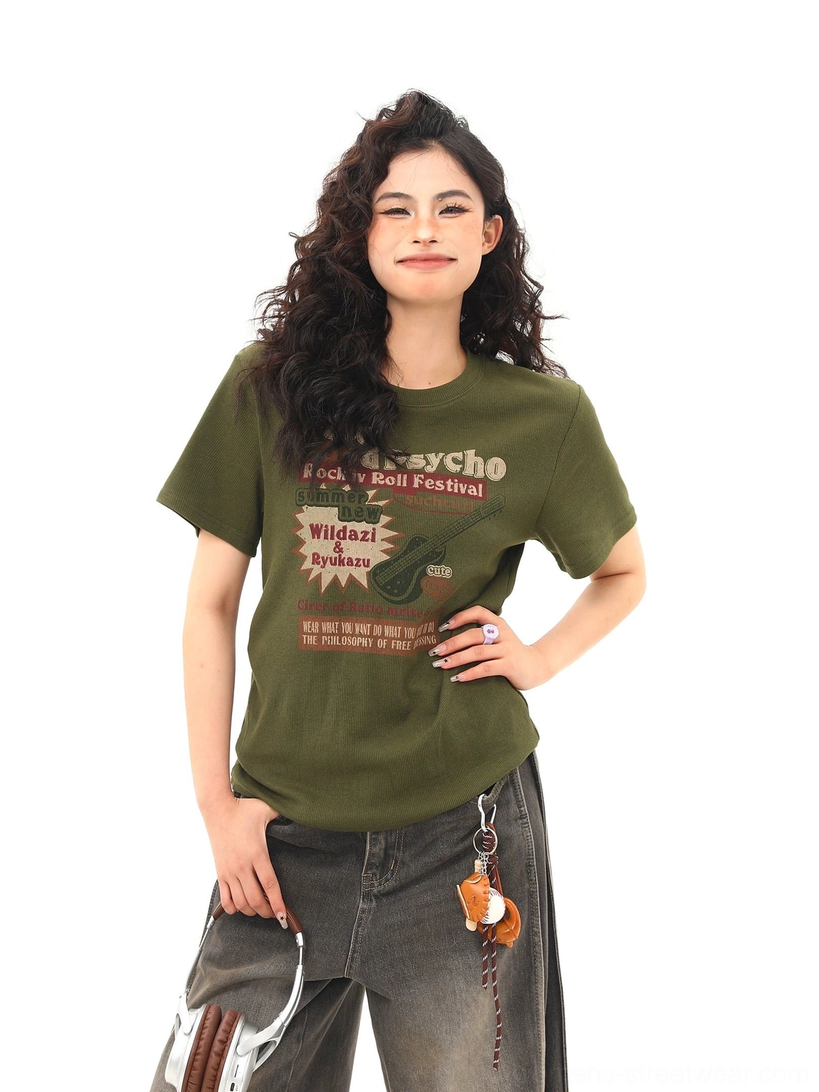 Front close-up of an olive green vintage rock festival graphic T-shirt with retro guitar and typography print, crew neckline, and short sleeves