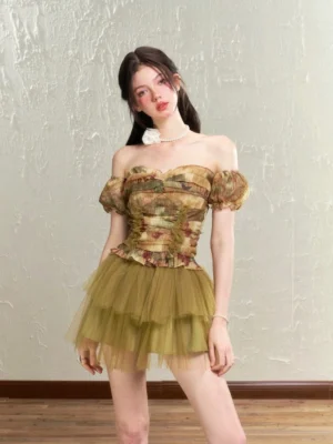 Olive green vintage rose print tulle corset top and layered mini skirt set with detachable puff sleeves shown in a front full-body studio view