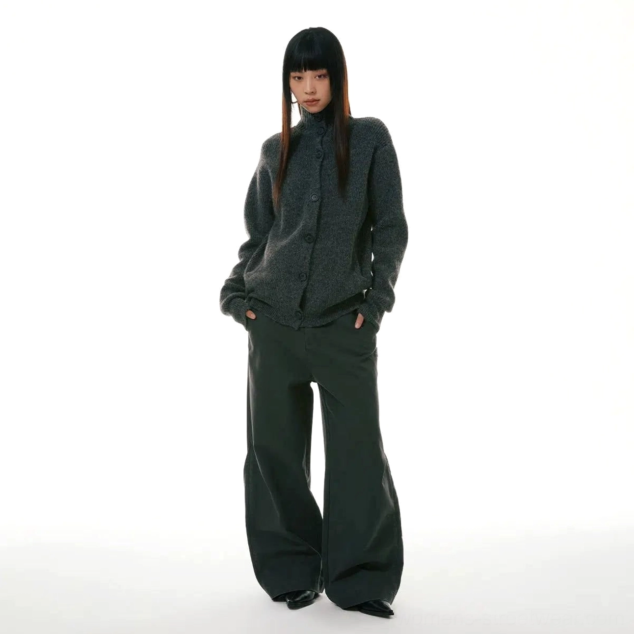 Olive green relaxed wide-leg workwear denim jeans styled with a cropped gray knit cardigan in a full-body front view