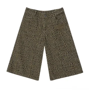 Flat lay view of olive leopard print baggy denim work shorts with wide legs and distressed details