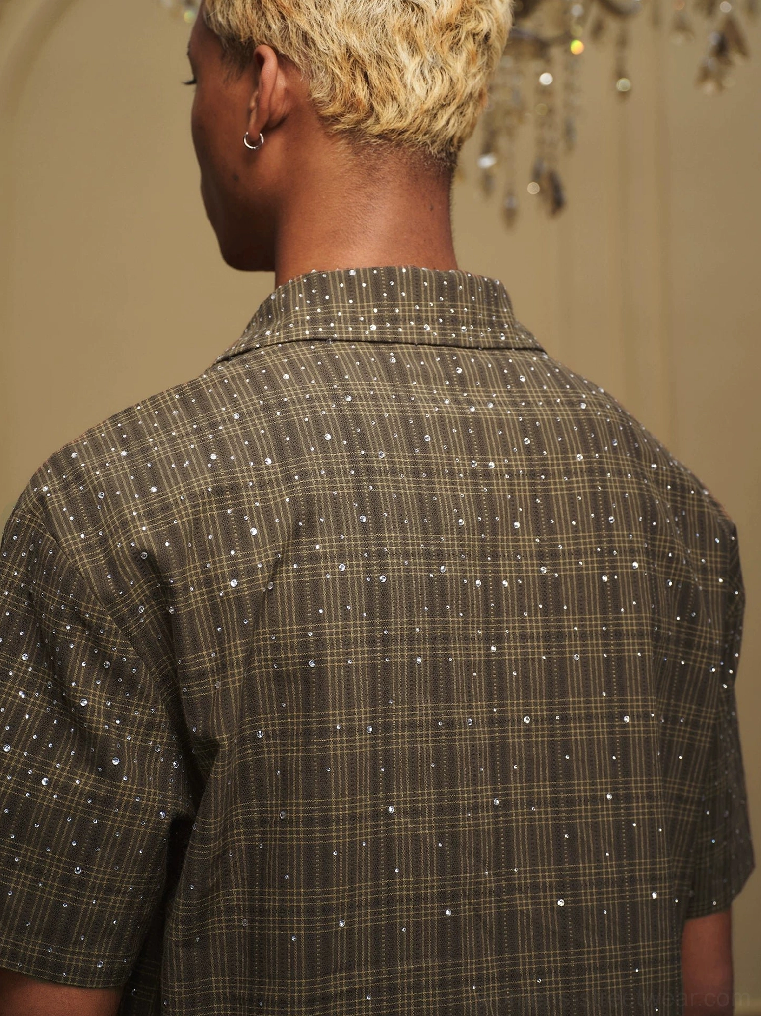 Close rear detail of dark olive tartan plaid shirt with scattered sparkling rhinestone embellishments