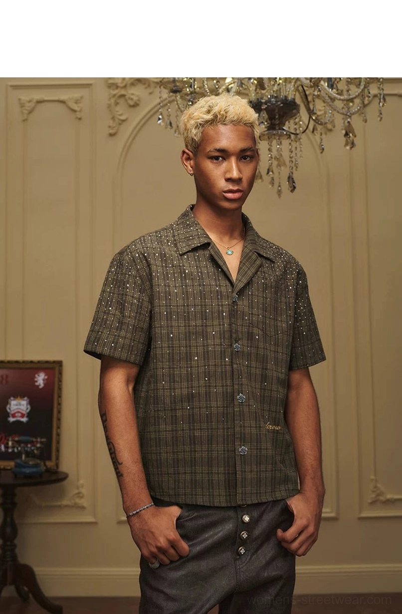Male model wearing olive rhinestone plaid camp collar short sleeve shirt in a vintage studio