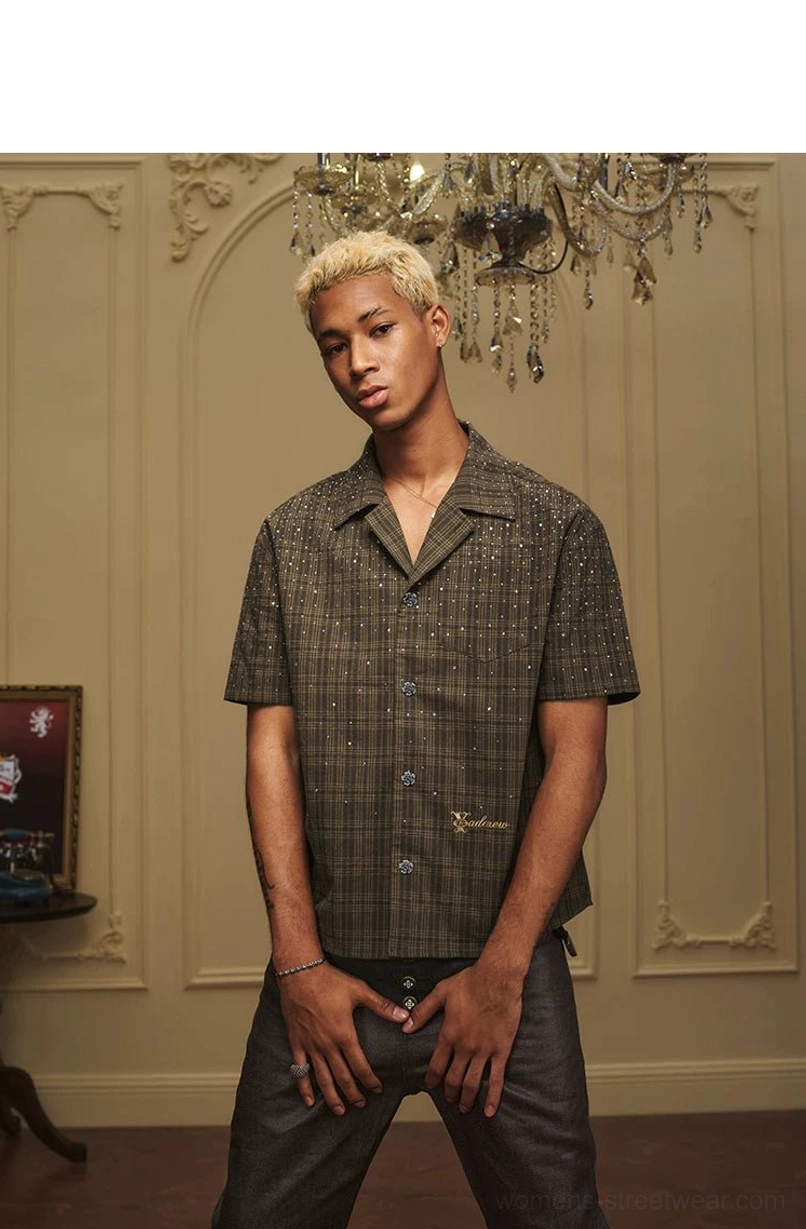 Olive tartan rhinestone camp collar streetwear shirt paired with relaxed dark trousers on male model