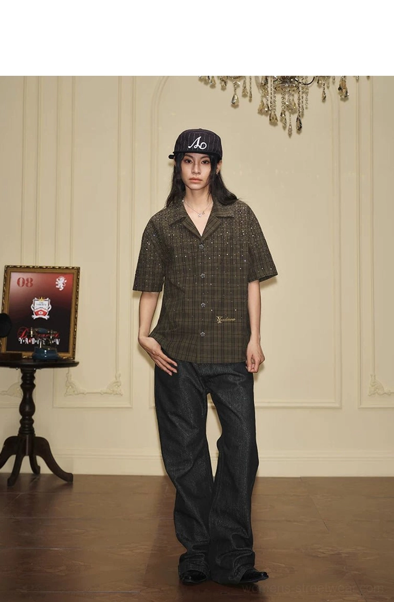 Rear full body view of female model wearing olive rhinestone plaid camp collar shirt with wide leg jeans