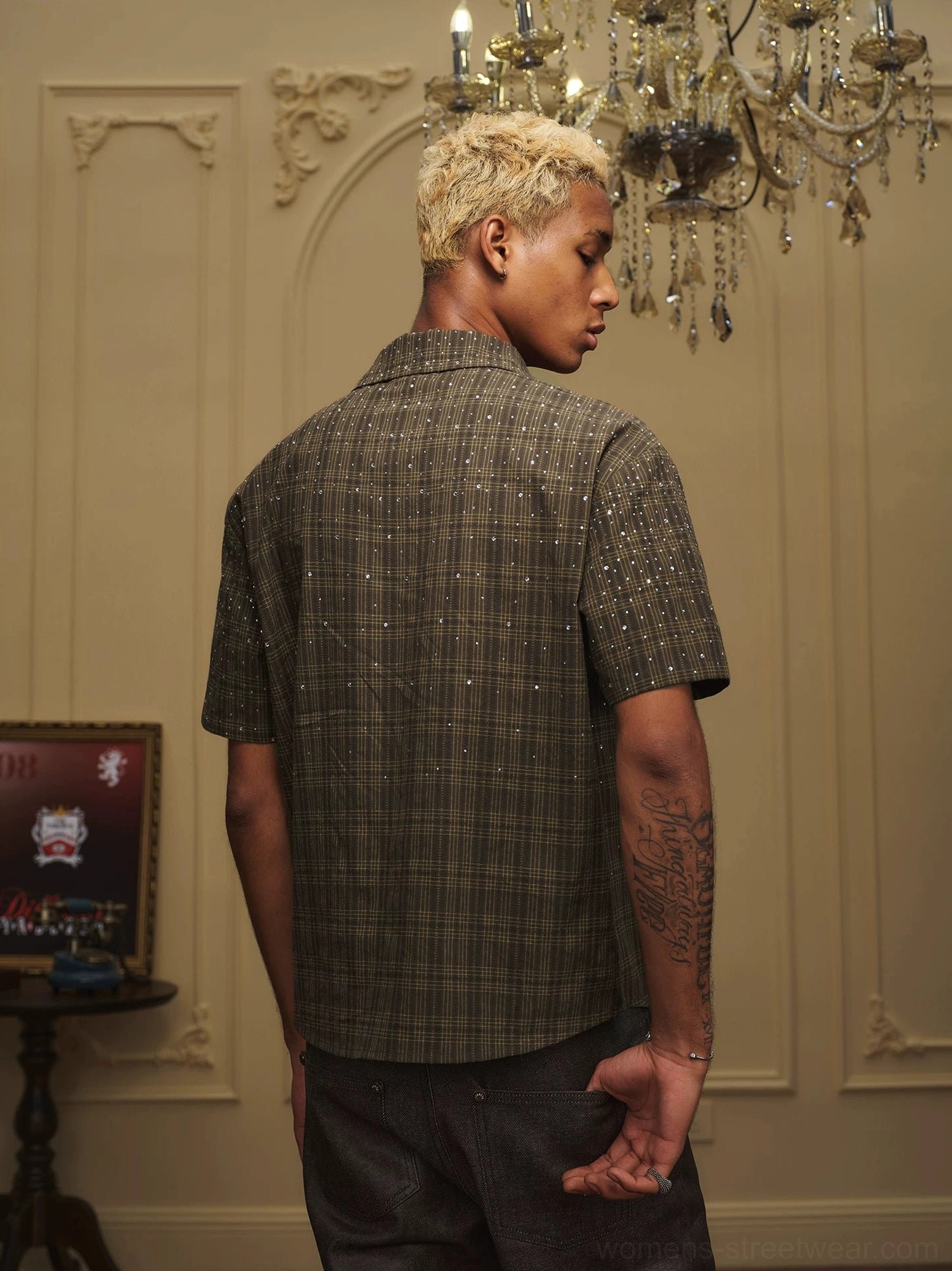 Rear view of olive rhinestone plaid camp collar streetwear shirt with short sleeves on male model