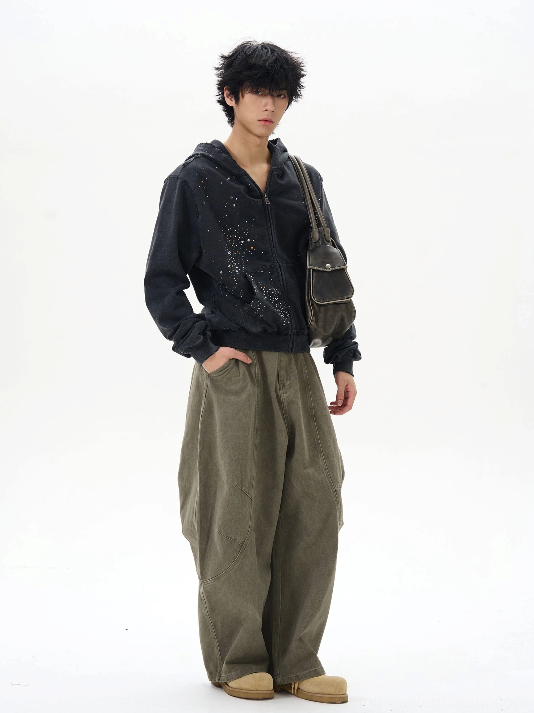 Olive green oversized cargo pants styled with a black hoodie in a relaxed Korean streetwear outfit