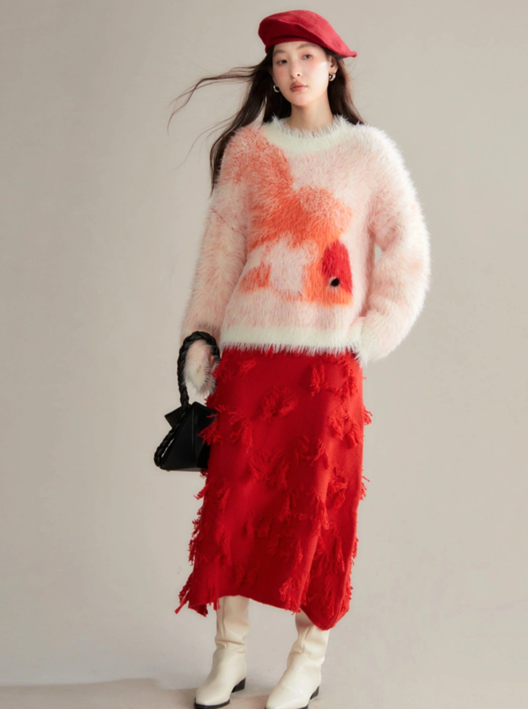 Front angle of orange-red koi fuzzy sweater showing straight hem, pale contrast trim, and comfortable drop shoulder sleeves