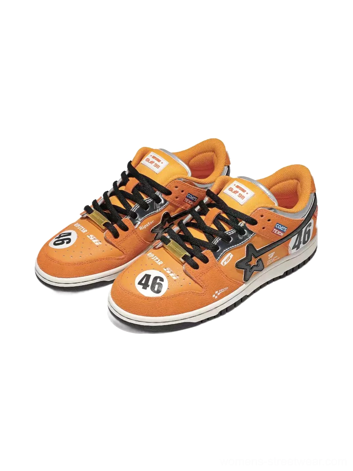 Pair of orange racing skate sneakers shown from an elevated front-side angle with black star panels, No. 46 toe and heel graphics, and black laces