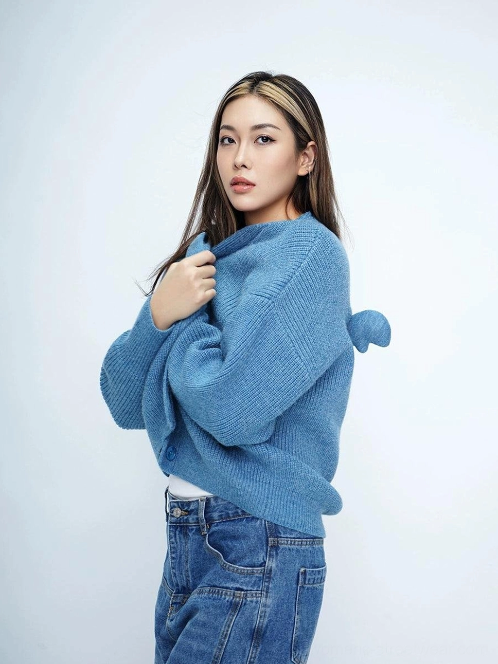 Denim blue oversized angel wing fuzzy knit cardigan styled with high waisted jeans
