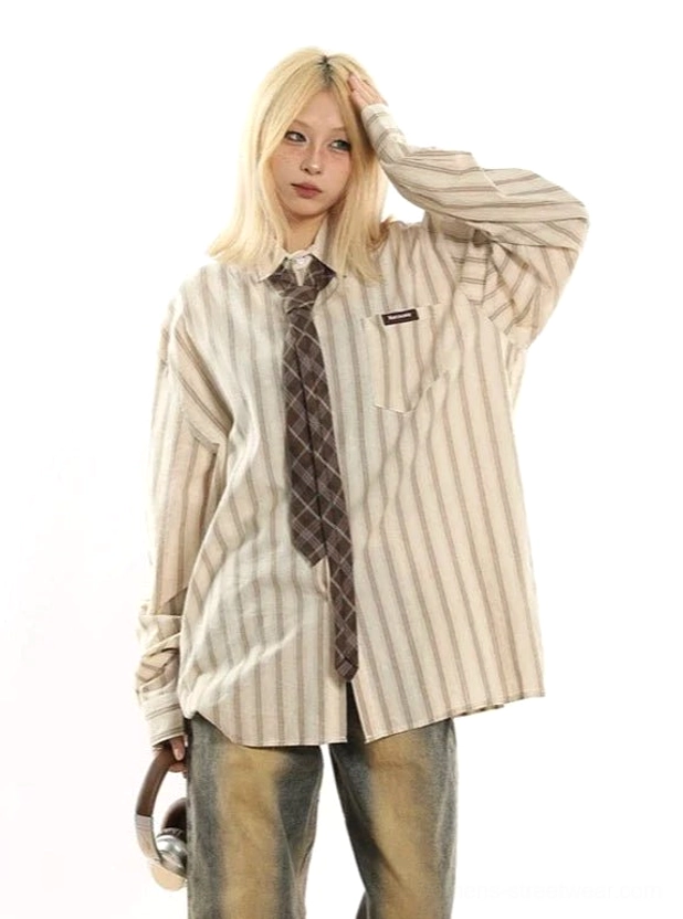 Side view of oversized apricot pinstripe shirt with plaid tie, full length sleeves, and loose streetwear fit