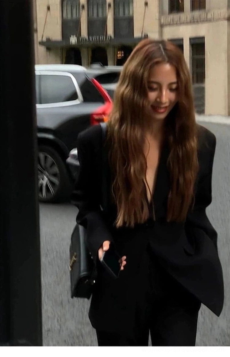 Black oversized single-button blazer jacket with side pockets worn for casual urban streetwear styling